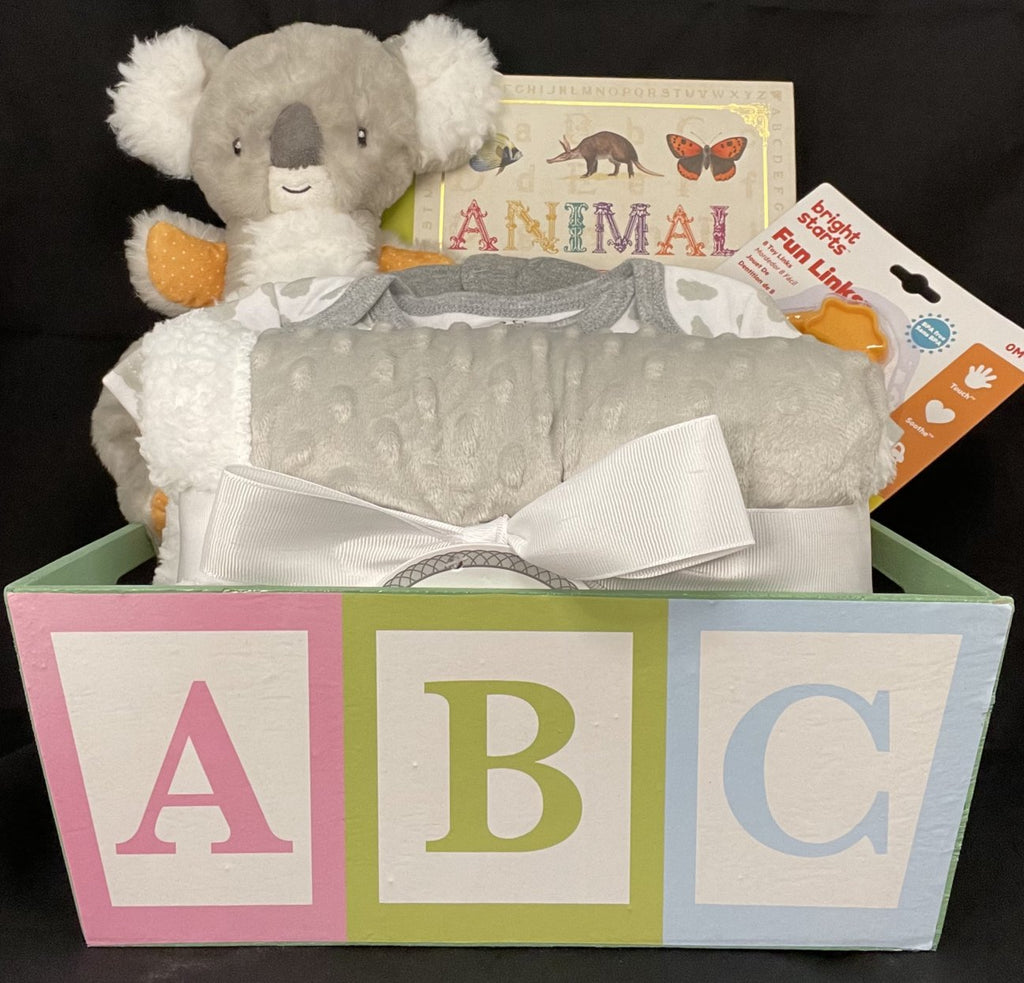 Our collection of fast shipping baby gifts includes this giraffe-themed gift set that includes a plush giraffe, blanket, and more.
