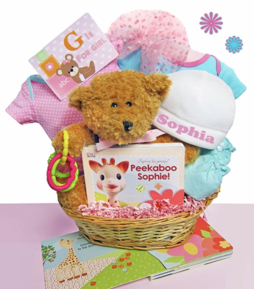 Our collection of personalized baby gift baskets and mini wagons includes this baby girl basket set with a teddy bear, personalized cap, book, and more.